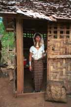 Jpeg 58K Padaung woman at the door of her house 8812j01