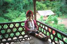 Jpeg 45K Padaung woman sitting in the verandah of her house 8812J04A